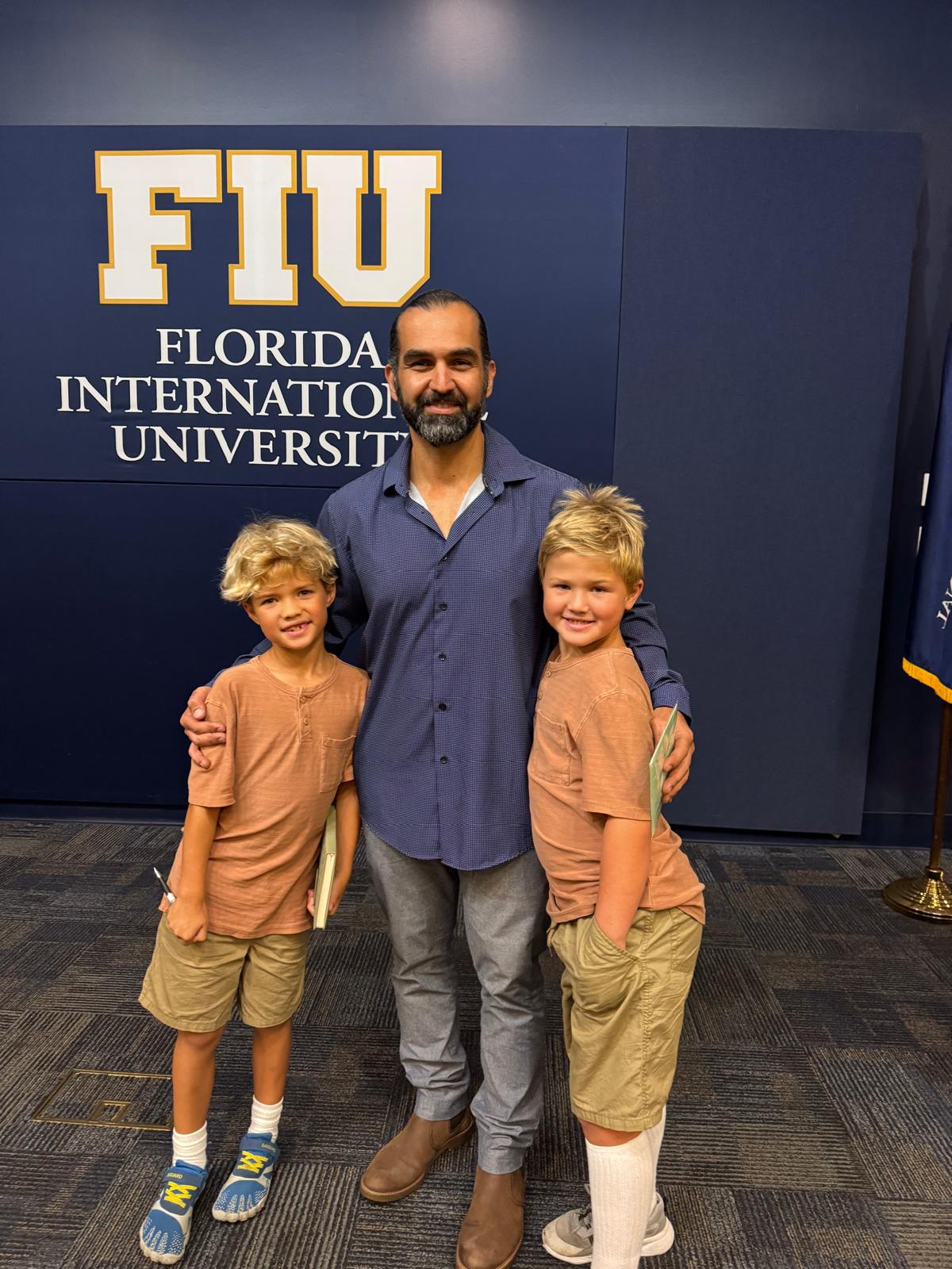 Gabriel with his sons at the FIU launch